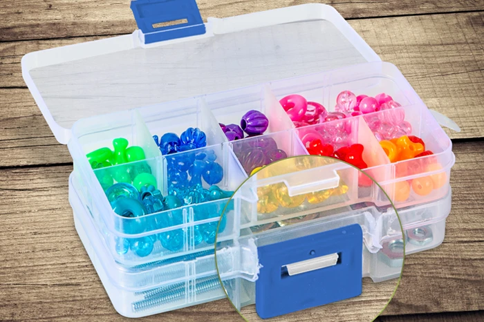 A top down look at two stacked Tidy Hero Minis, the top box open and displaying organized, brightly colored crafting beads.